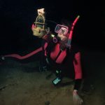 Another "not a reef scene", but it is one of my favorites from inside of a WWII era Japanese wreck. The Shinkoku Maru was a Japanese fleet oiler that was sunk in Truk Lagoon during the U.S. Navy's Operation Hailstone in February 1944.  Sandy was extremely careful not to move her fins, gently holding on to the floor.  One kick of a fin and the scene would have been obliterated with silt. You can see a small cloud of silt by her hand. Truk Lagoon, Micronesia (Chuuk) in 1996