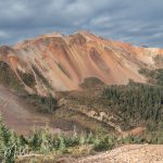 Although the road is wide and graded (at times), it becomes steep and can be rough in spots with several sharp switchbacks. It felt intimidating to me when looking out the windshield, I could not see the road in front of me — only sky.