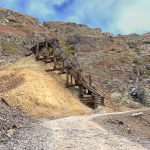 Miost likely part of the Sampson Mine ore‑handling system, used to funnel mined rock from tunnels down to wagon carts below.
