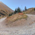 American Basin is a popular hiking and camping area known for its stunning alpine scenery, July wildflowers, and mountain views. The road to thye left starts out ok, but it becomes les and les of a road as you gaon elevations.