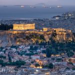 The distance to the Acropolis from this location is 1.1 miles, twice the distance as from our hotel viewpoint. In addition, the viewing area where we stopped is 400 feet higher than the Acropolis itself. This vantage point provides the opportunity to showcase the Acropolis as the visual centerpiece of Athens. The direction to the Parthenon is now southwest, revealing both the east end and the north side. To the right of the Parthenon is a temple and the entrance to the top of the Acropolis (shown later). I used a 200mm telephonto lens (full frame equivalent) to show a larger scene, but the night lighting still makes the Acropolis the center of attention. (3087)