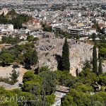 The site of the ancient Areopagus Council, one of Athens' oldest governing institutions. It sits just northwest of the Acropolis and is directly across from the area near the Acropolis entrance. Also pictured is the red-domed Church of the Holy Apostles Solakis. (3931)