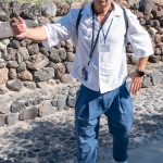 Our guide for a visit to Akrotini, a Bronze Age town on Santorini that flourished around 1600 BCE. It was buried under thick layers of volcanic ash during a massive eruption on Santorini, preserving buildings, streets, pottery, and colorful wall paintings in a way often compared to Pompeii. Unlike Pompeii, few human remains have been found, indicating the population had time to escape. (2843)