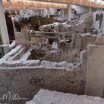 The excavated town is unusually fragile because many walls are made from materials such as mudbrick and volcanic stone rather than massive marble blocks. When the city was buried in ash, it was preserved for thousands of years in a relatively sealed environment. Once exposed to open weather, deterioration would accelerate . . . therefore, the roof. (2846)