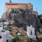 The cathedral sits high above Ermoupoli on the steep medieval quarter of Ano Syros. From below, it looks less like a grand cathedral and more like a fortified church anchored into the hillside — exactly what it was designed to be in a period when defensive positioning mattered. (2955b)