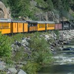During its 45-mile journey to Silverton, the historic steam train climbs nearly 3,000 feet from Durango. The journey through the San Juan National Forest reveals cool alpine forests, towering peaks, waterfalls, and river rapids.