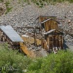 Near Silverton, the evidence of Colorado's mining heritage becomes apparent. Hundreds of mining claims once dotted the surrounding mountains, and weathered structures remain scattered across the alpine landscape.